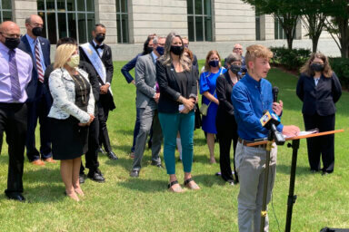 Dylan Brandt speaks at a news conference outside the federal courthouse in Little Rock, Ark., July 21, 2021.