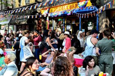 Crowds hover around Ginger's Bar at Brooklyn Pride.