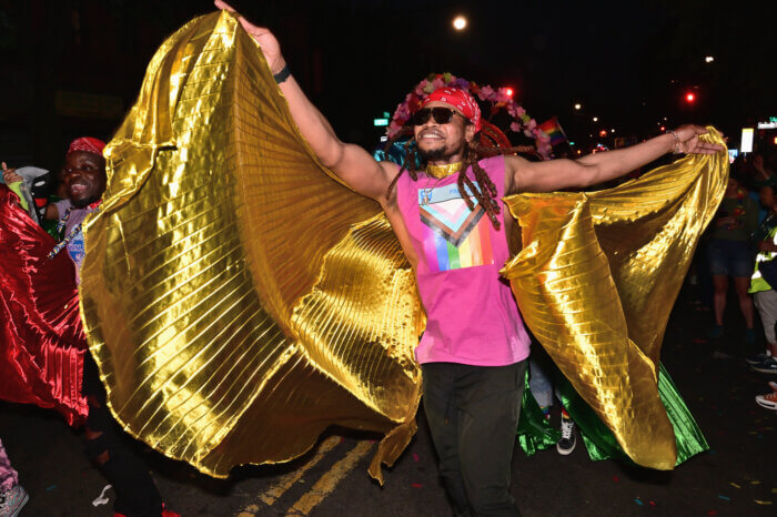 Revelers dance into the evening during the city's only twilight Pride March.