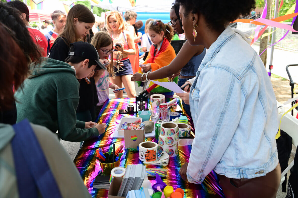 Kids swarm the Brooklyn Public Library's booth at Youth Pride in Brooklyn.