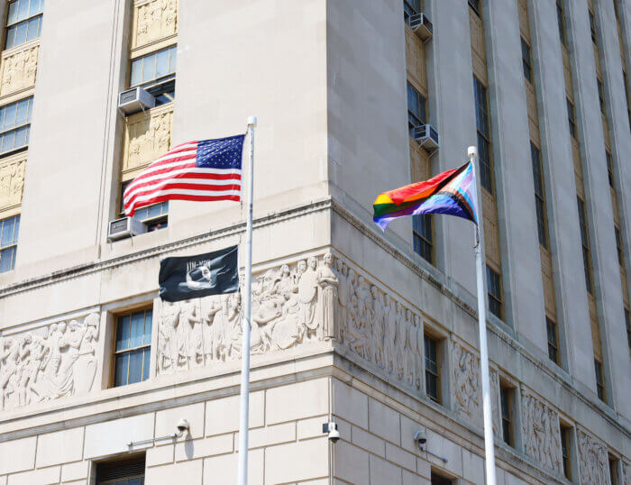 The American Flag and Progress Pride Flag at the Bronx County Building.