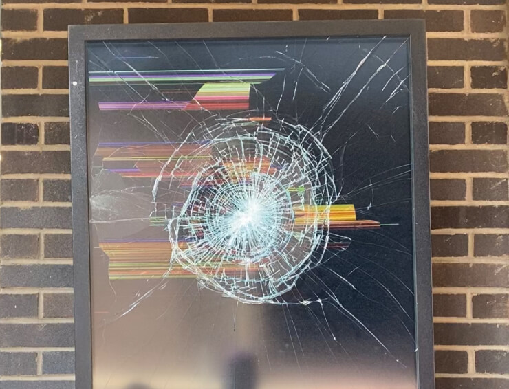 An unknown individual smashed the screen on display outside of The Flea.
