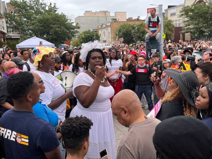Qween Jean delivers remarks on Aug. 4, 2023 at the Mobil gas station where O'Shae Sibley was killed.