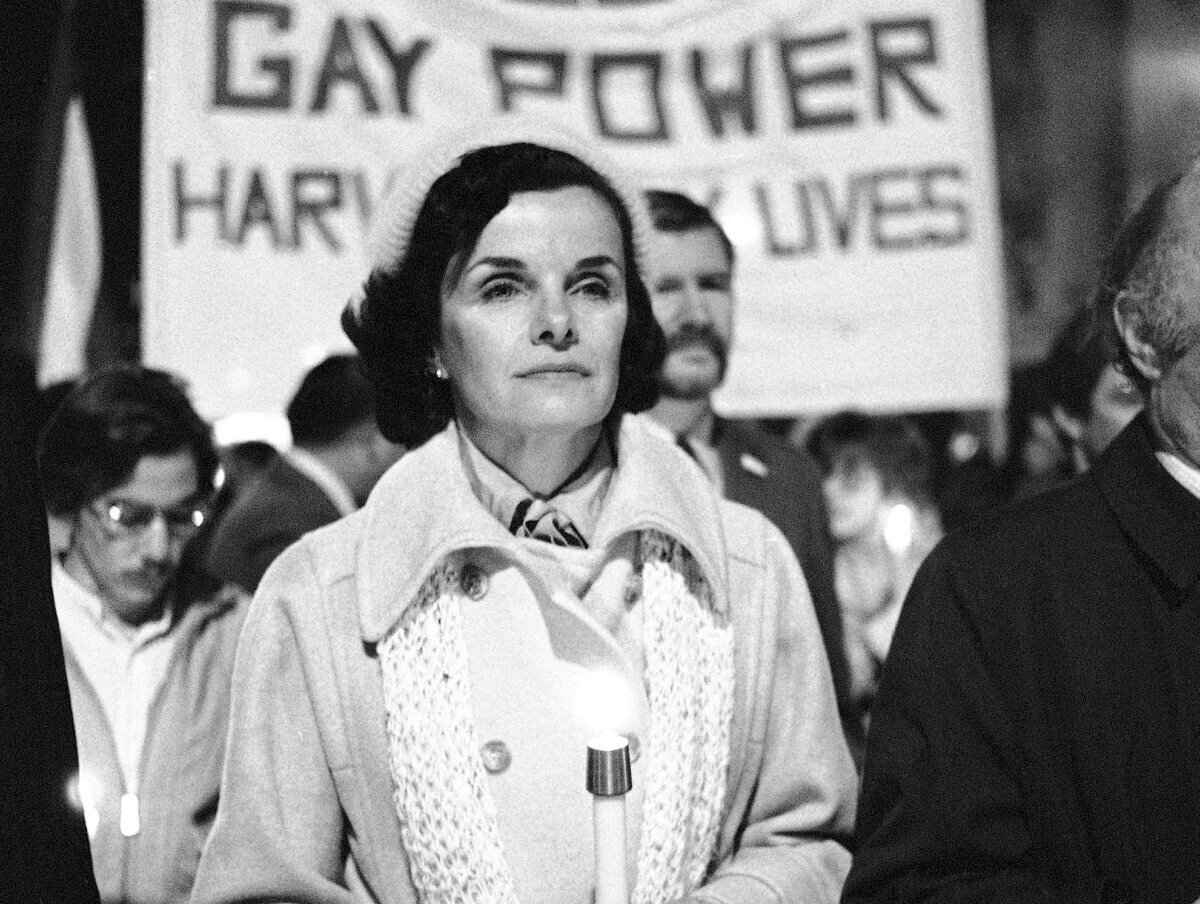 Former San Francisco Mayor Dianne Feinstein carries a candle as she leads an estimated 15,000 marchers also carrying candles during a march in memory of slain Mayor George Moscone and Supervisor Harvey Milk in San Francisco, Nov. 28, 1979.