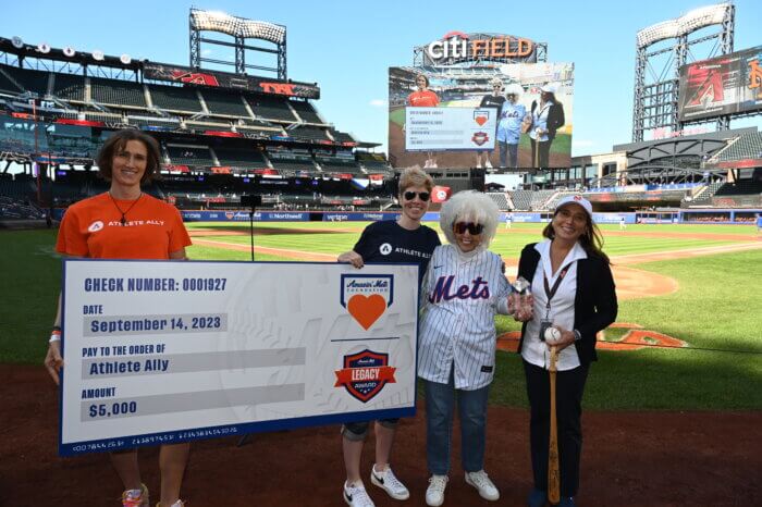Maybelle Blair and the Mets present a check to Athlete Ally.