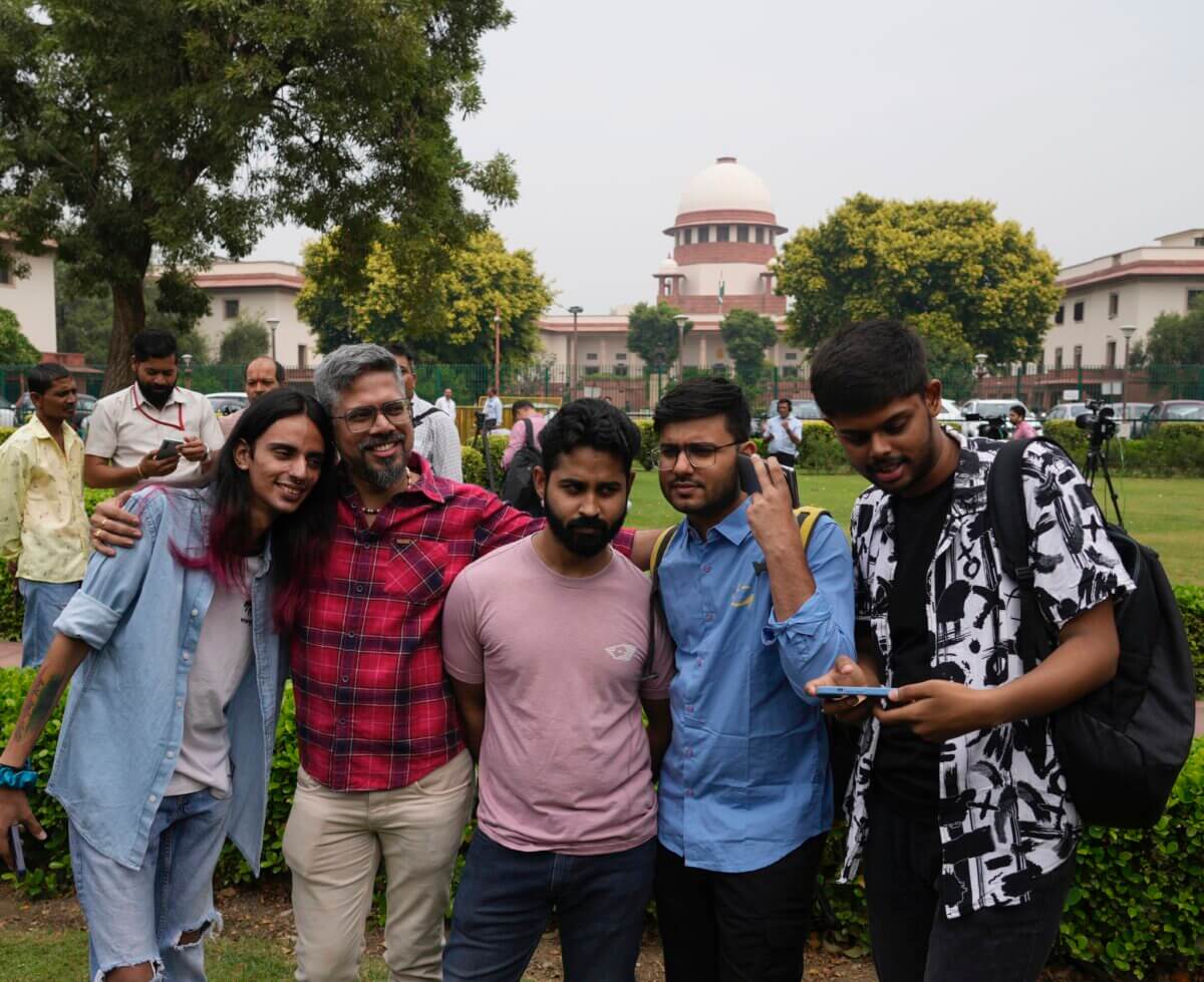 LGBTQ community supporters and members wait for the Supreme Court verdict on petitions that seek the legalization of same-sex marriage, in New Delhi, India, Tuesday, Oct. 17, 2023.
