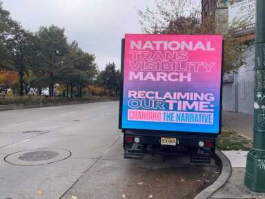 A truck displays a digital billboard promoting the 2023 National Trans Visibility March near the Christopher Street Pier on Manhattan's west side.
