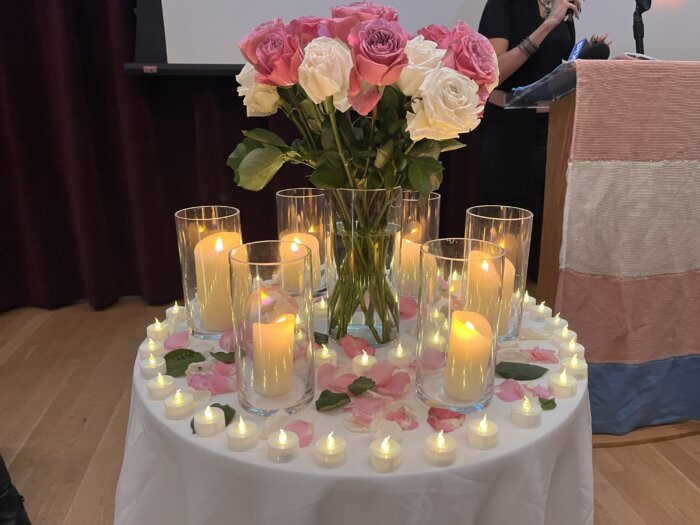 Candles adorn a table near the front of the room during a Transgender Day of Remembrance event at The LGBT Center.