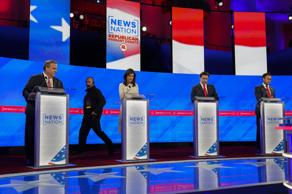 Former New Jersey Gov. Chris Christie, left, former UN Ambassador Nikki Haley, Florida Gov. Ron DeSantis, and businessman Vivek Ramaswamy prepare before a Republican presidential primary debate hosted by NewsNation on Wednesday, Dec. 6, 2023, at the Moody Music Hall at the University of Alabama in Tuscaloosa, Ala.