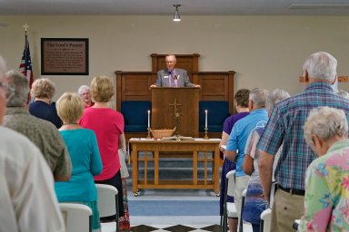 The Rev. Bill Farmer, center, speaks to members of the congregation during service at the Grace Methodist Church Sunday, May 14, 2023, in Homosassa Springs, Fla.