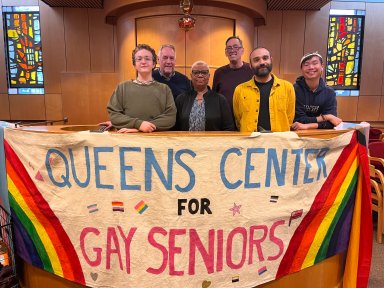 Queens Center for Gay Seniors' staff members in the main activity room.