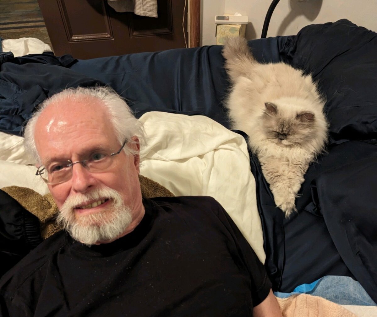 Ken Sherrill with his cat, Bella. Ken died at the age of 81.