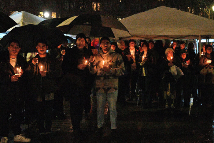 Advocates hold candles during the Out of the Darkness vigil.
