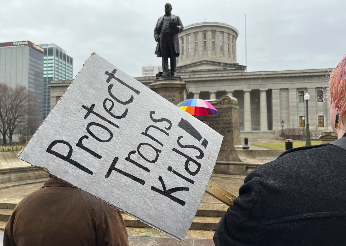 Protesters advocating for transgender rights and healthcare stand outside of the Ohio Statehouse on Wednesday, Jan. 24, 2024, in Columbus, Ohio.