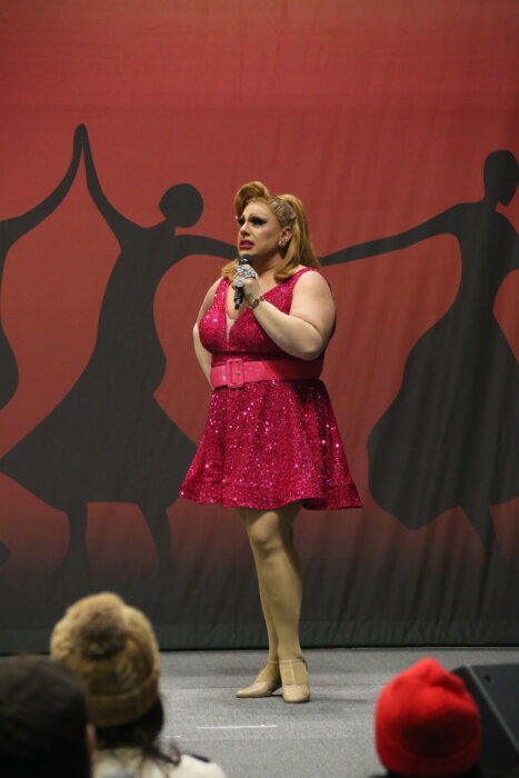 Drag persona Delta Miles speaks from the stage at the New York Travel & Adventure Show in the LGBTQ Pavilion, Saturday January 27, 2024.