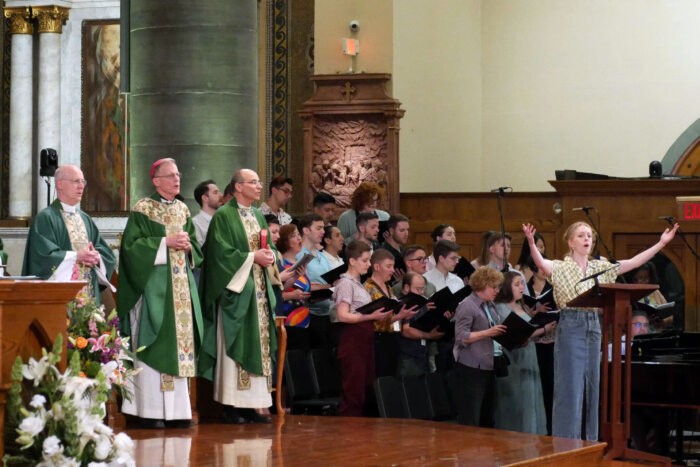 In this photo provided by America Media, from left, the Rev. James Martin, Archbishop John Wester of Santa Fe, N.M., and Rev. Eric Andrews attend the closing Mass for the Outreach conference at the Church of St. Paul the Apostle, in New York, June 18, 2023.
