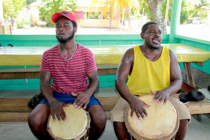 Drummers play and sing traditional Garifuna songs at Tugusina Garifuna Hopkins Village in southern Belize.