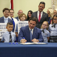 Florida Gov. Ron DeSantis signs the Parental Rights in Education bill, also known as the "Don't Say Gay" bill, at Classical Preparatory School, March 28, 2022, in Shady Hills, Fla.