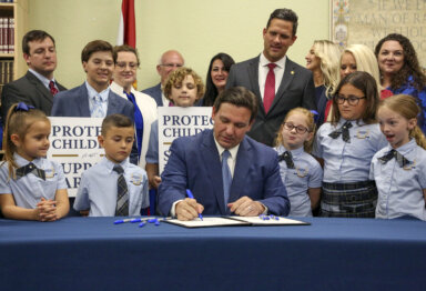 Florida Gov. Ron DeSantis signs the Parental Rights in Education bill, also known as the "Don't Say Gay" bill, at Classical Preparatory School, March 28, 2022, in Shady Hills, Fla.