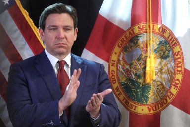 Florida Gov. Ron DeSantis applauds during a press conference at the Central Florida Tourism Oversight District headquarters at Walt Disney World, in Lake Buena Vista, Fla., Thursday, Feb. 22, 2024.
