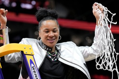 South Carolina head coach Dawn Staley cuts down the net after the Final Four college basketball championship game against Iowa in the women's NCAA Tournament, Sunday, April 7, 2024, in Cleveland.