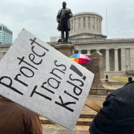 Demonstrators advocating for transgender rights and healthcare stand outside of the Ohio Statehouse on Jan. 24, 2024, in Columbus, Ohio.