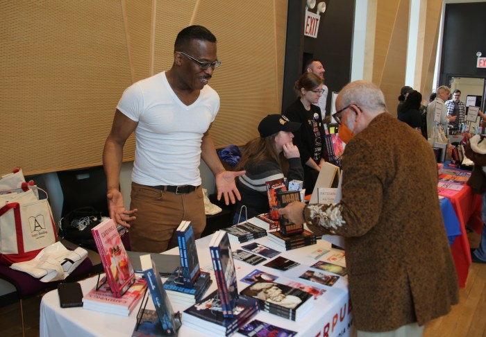 HL Sudler of Archer Publishing, based in Washington DC, speaks to a patron at the Rainbow Book Fair.