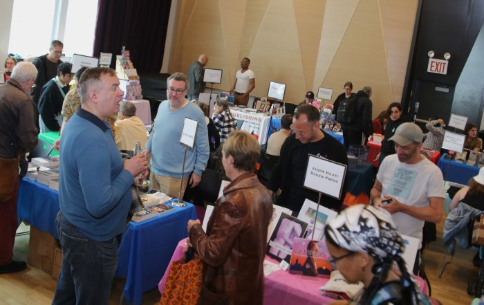 A crowd packs the room at the Rainbow Book Fair.