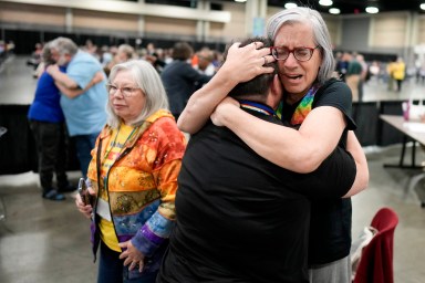 Angie Cox, left, and Joelle Henneman hug after an approval vote at the United Methodist Church General Conference Wednesday, May 1, 2024, in Charlotte, N.C.