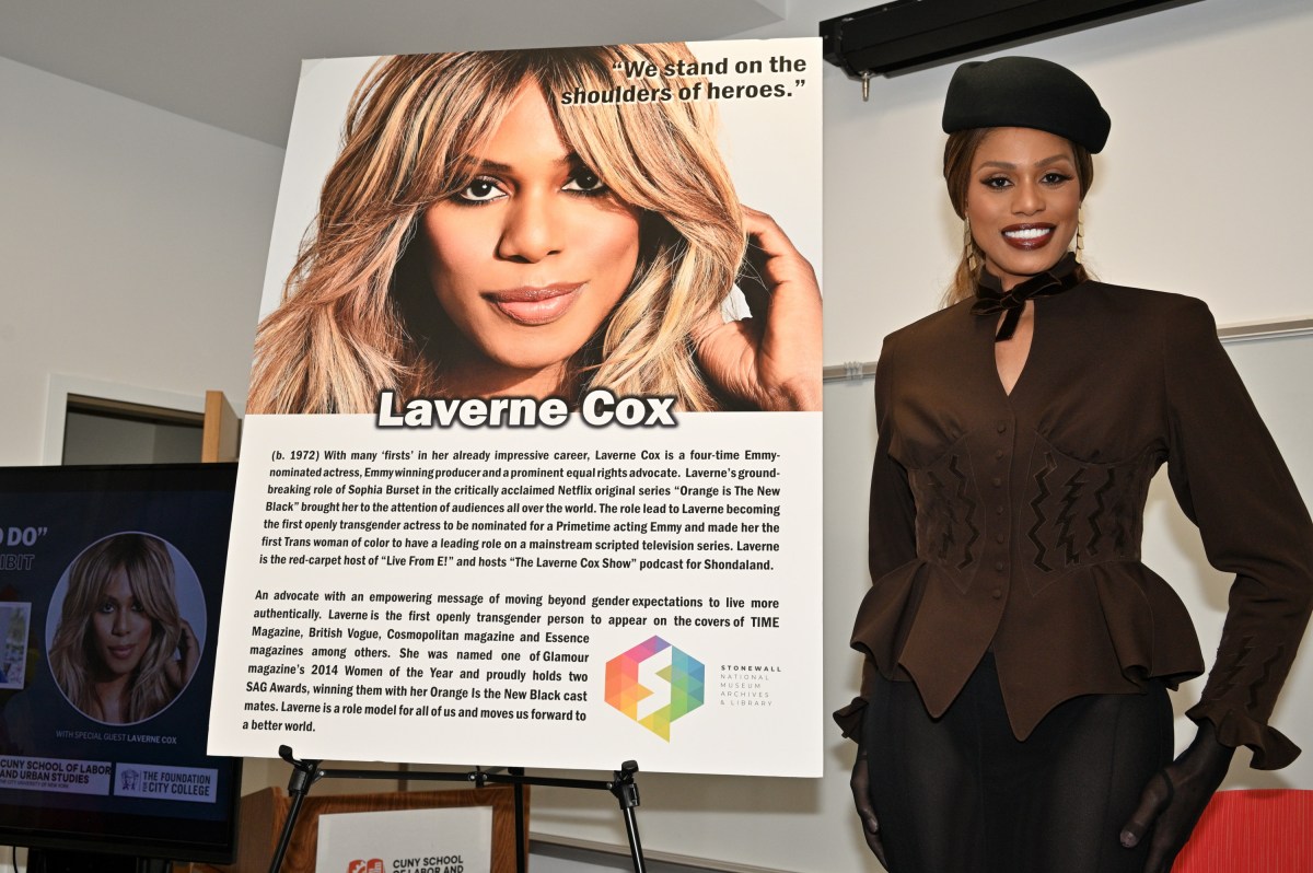 Laverne Cox stands next to her portrait poster after it was unveiled.