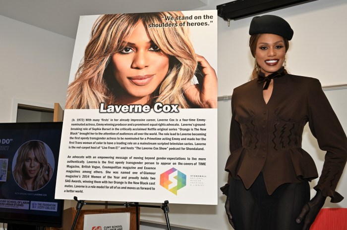 Laverne Cox stands next to her portrait poster after it was unveiled.