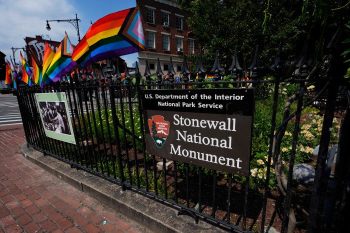 A National Park Service sign marks the Stonewall National Monument outside the Stonewall Inn, Monday, June 17, 2024, in New York. The building will open as the new visitor center for the Stonewall National Monument on Friday, June 28, the anniversary of the 1969 rebellion that helped reshape LGBTQ+ life in the United States.