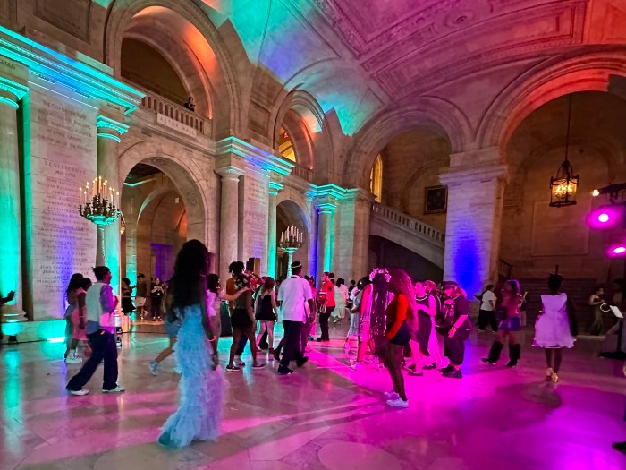 Anti-Prom attendees form a conga line under the vaulted ceiling of Astor Hall.