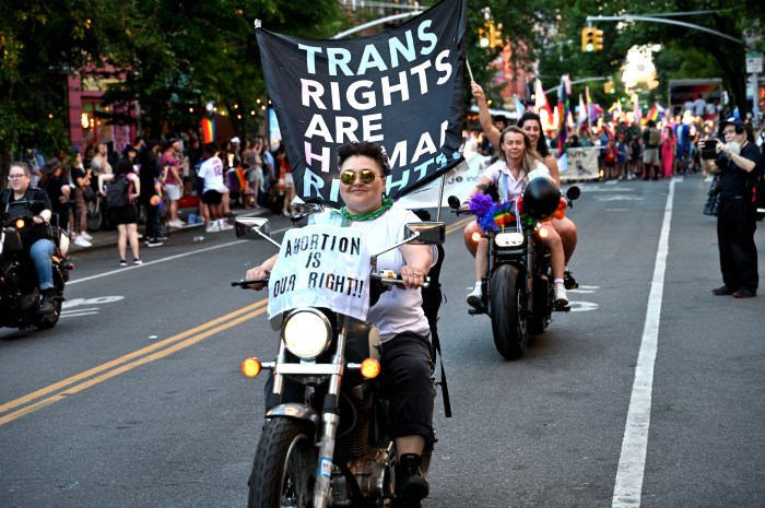 Dykes on Bike, with messages of support for trans rights and abortion rights, roar along Fifth Avenue.