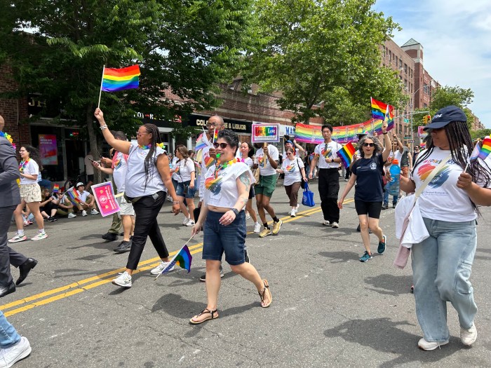 Marchers make their way through the streets of Jackson Heights at Queens Pride on June 2.