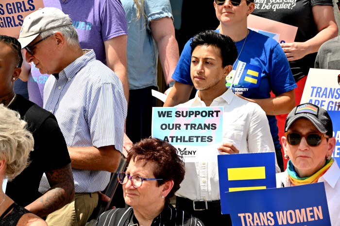 Advocates show their support for trans athletes.