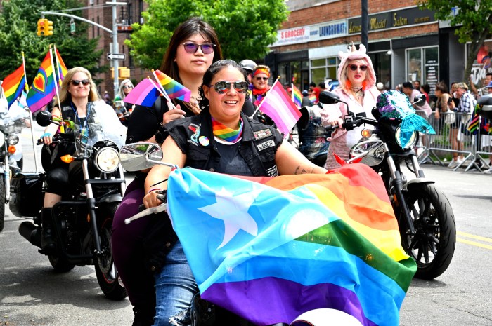 Dykes on Bikes roaring along the streets of Jackson Heights.