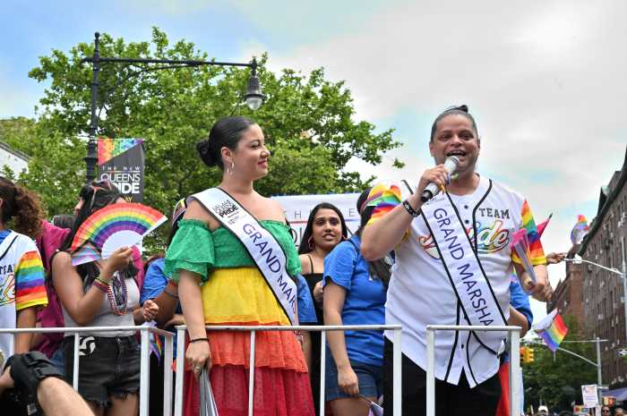 The 2024 grand marshals on the Queens Pride float.