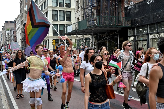 Waving the Rainbow Flag high above the march.