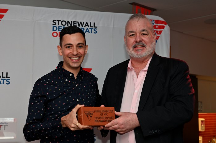 Stonewall Democratic Club of NYC president Gabriel Lewenstein presents O'Donnell with his award.