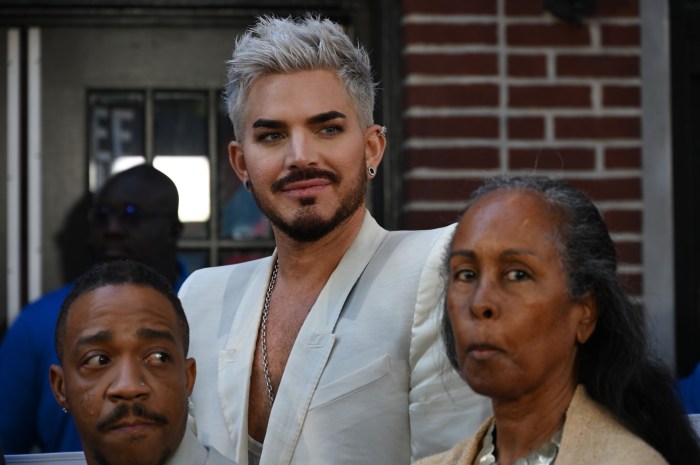 Adam Lambert looks on during the ribbon-cutting ceremony.