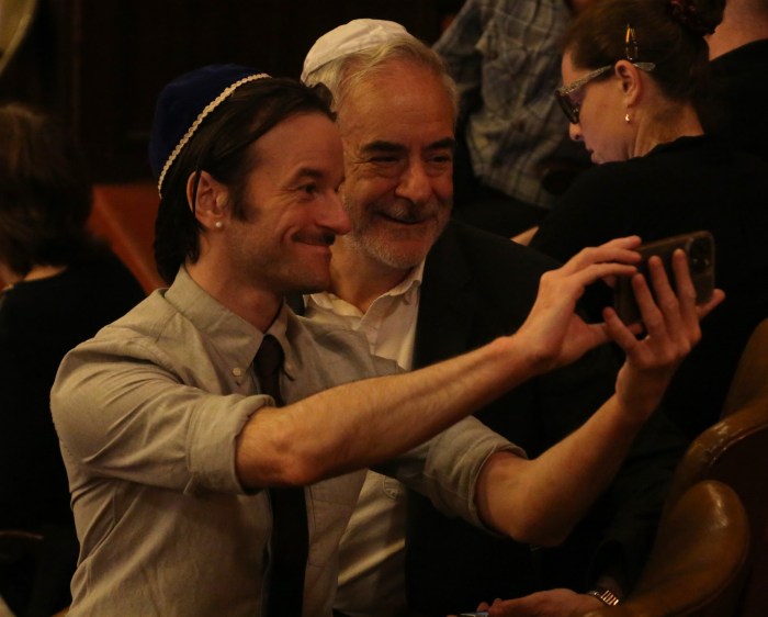 Congregants take selfies during Congregation Beit Simchat Torah's Pride Shabbat on June 28.