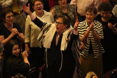 Rabbi Sharon Kleinbaum sings and dances with the congregation during the Congregation Beit Simchat Torah Pride Shabbat on June 28, 2024 at Masonic Hall.