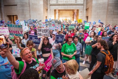 Protesters chant as they are heard in the legislative chamber during a final reading on a bill that combined a 12-week abortion ban with a measure to restrict gender-affirming care for people under 19, May 16, 2023, at state Capitol in Lincoln, Neb.