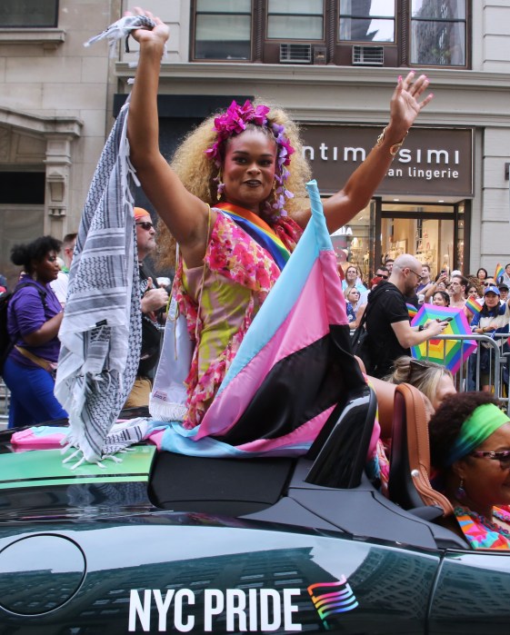 Grand Marhsal Raquel Willis embraces the crowd.