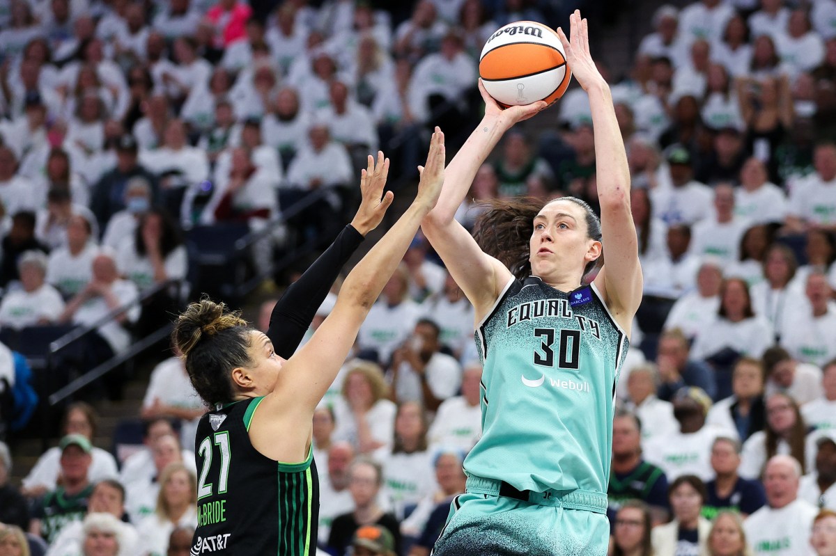 New York Liberty forward Breanna Stewart (30) shoots as Minnesota Lynx guard Kayla McBride (21) defends during the second half of game three of the 2024 WNBA Finals at Target Center on Oct. 16.