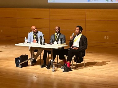 Shane Tull, Uche Onwa, and Dr. Julian Watkins during a panel discussion at The New School's Tisch Auditorium on Oct. 11.