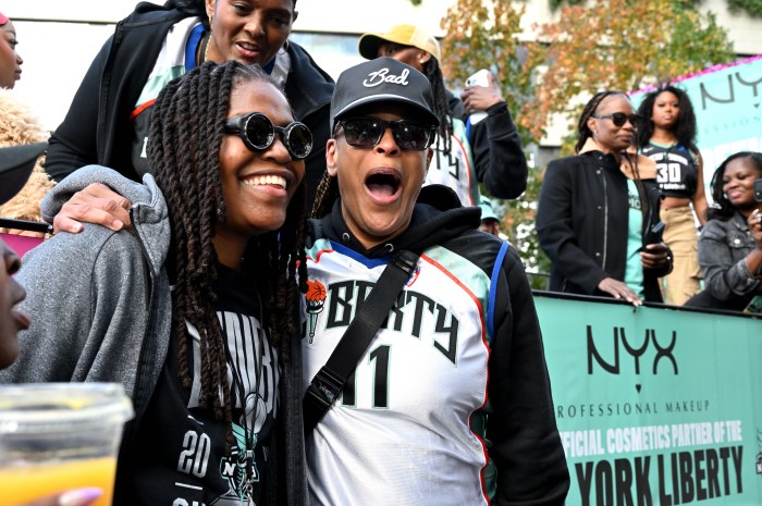 Jonquel Jones with Teresa Weatherspoon, who is now a coach but previously played on the Liberty's inaugural team in 1997.