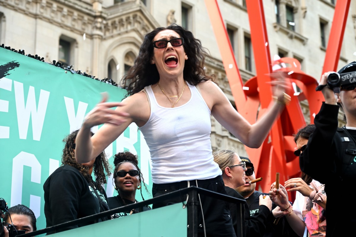 Liberty star Breanna Stewart celebrates during the Oct. 24 parade.