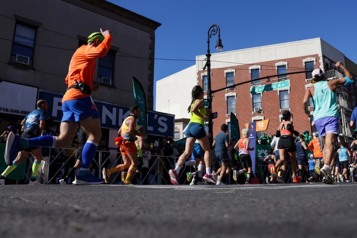 Competitors run on Bedford Avenue in Brooklyn during the 2024 TCS New York City Marathon on November 3, 2024. 